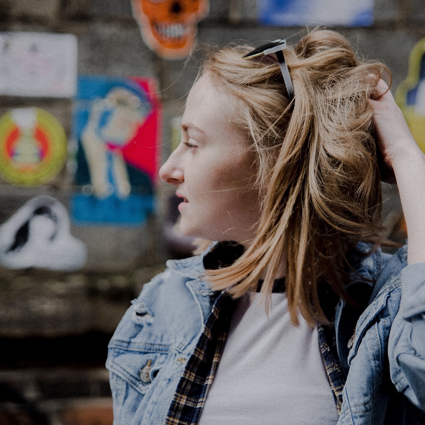 becky chamberlain singer performer portrait  looking out whilst touching her hair