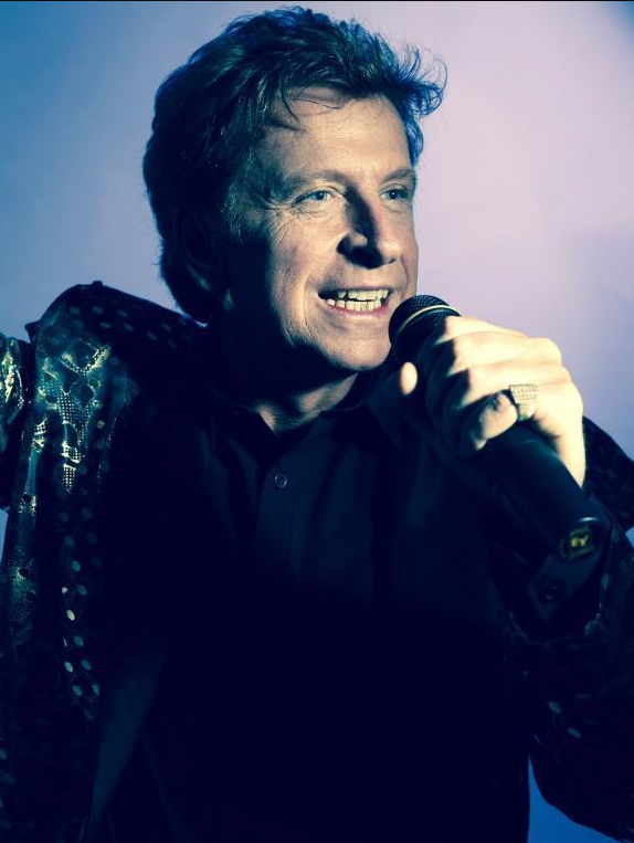 barry manilow tribute pose man with microphone to mouth